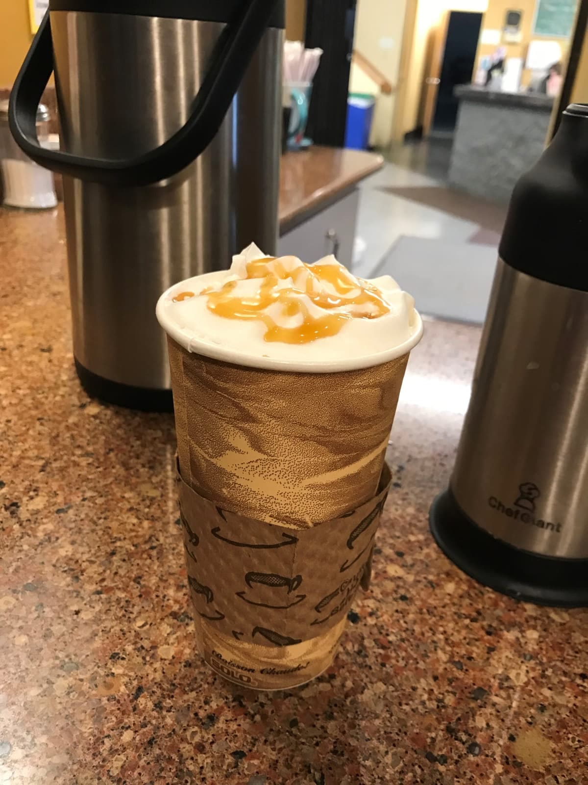 A latte with foam art from Warmups